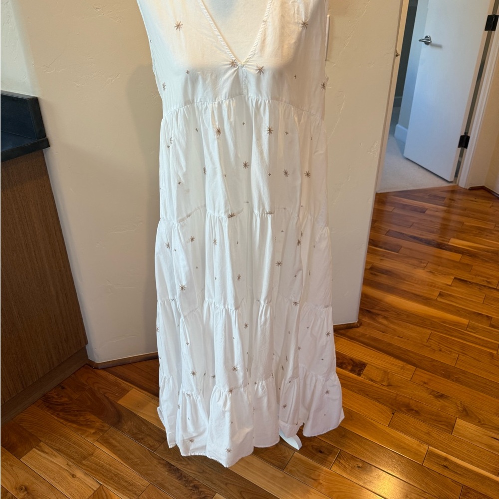 Chic White Maxi Dress with Star Accents from Merlette